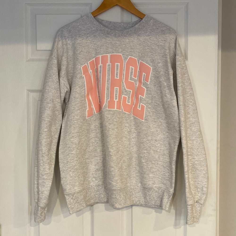 Gray Sweater with Nurse written on front